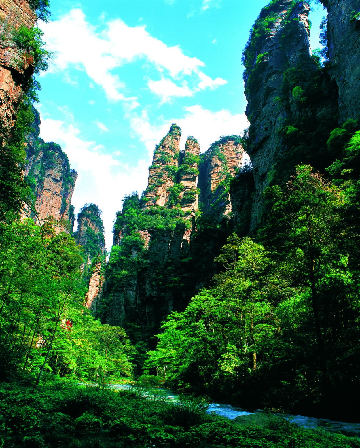 Sandstone towers above Golden Whip Stream at Qianli Xianghui